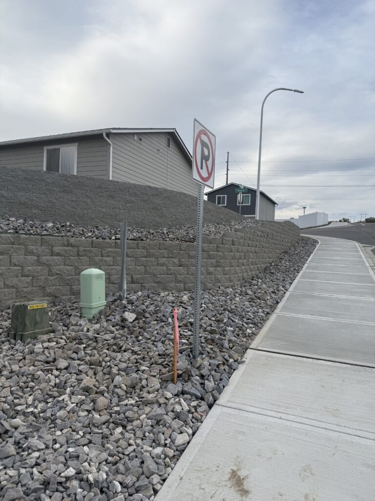 Here, we built a retaining wall to level out a sloped area in our client's Back yard.